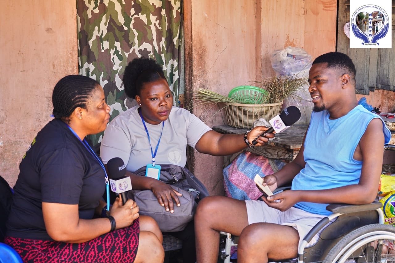 A healthcare worker speaking with a community member